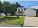 Charming two-story home with attached garage and well-maintained landscaping at 216 Edgecombe Dr, Spring Lake, NC 28390