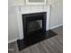Elegant fireplace featuring white trim, and a black firebox and hearth at 216 Edgecombe Dr, Spring Lake, NC 28390