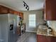 Kitchen featuring stainless steel appliances, granite countertops, and dark wood cabinets at 216 Edgecombe Dr, Spring Lake, NC 28390
