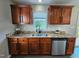 Kitchen sink with granite counters, stainless steel appliances, and wood cabinetry at 216 Edgecombe Dr, Spring Lake, NC 28390