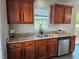 Updated kitchen with granite countertops and stainless steel appliances at 216 Edgecombe Dr, Spring Lake, NC 28390