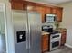 A modern stainless steel refrigerator and oven add to the appeal of this home's efficient kitchen at 216 Edgecombe Dr, Spring Lake, NC 28390