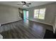 Spacious living room with stairs, bright window and view, and gray-toned wood floors at 216 Edgecombe Dr, Spring Lake, NC 28390