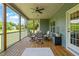 Back porch dining area, perfect for outdoor entertaining with a ceiling fan for added comfort at 216 Tarkenton Ct, Clayton, NC 27527