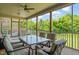Screened-in porch with ample seating and dining space, ideal for enjoying the outdoors bug-free at 216 Tarkenton Ct, Clayton, NC 27527