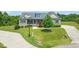 Well-maintained front yard featuring lush lawn and landscaping that enhances the curb appeal of this inviting home at 216 Tarkenton Ct, Clayton, NC 27527