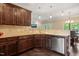 Kitchen showing stainless steel appliances, a breakfast bar, ample cabinet space, and modern finishes at 216 Tarkenton Ct, Clayton, NC 27527