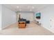 Bright living room with blue walls featuring a sofa, TV, wooden cabinet and rocking chair at 216 Tarkenton Ct, Clayton, NC 27527