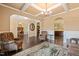 Open-concept living room showcasing elegant archways, hardwood floors, and seamless flow to other areas of the home at 216 Tarkenton Ct, Clayton, NC 27527