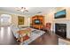 Inviting living room with a fireplace, hardwood floors, stylish furnishings, and plenty of space for relaxing and entertaining at 216 Tarkenton Ct, Clayton, NC 27527