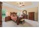 Spacious main bedroom features tray ceilings, a ceiling fan, a matching furniture set, and carpet flooring at 216 Tarkenton Ct, Clayton, NC 27527