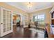 Bright office space with French doors, a large window with neighborhood views, and built-in shelving at 216 Tarkenton Ct, Clayton, NC 27527