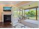 Comfortable screened porch features a ceiling fan, and a view of the backyard through the screens at 216 Tarkenton Ct, Clayton, NC 27527
