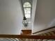 Bright foyer with large window, hardwood floors, and unique light fixture at 2208 Fieldmont Ct, Raleigh, NC 27614