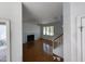 Inviting living room with fireplace, ceiling fan, and hardwood floors at 2208 Fieldmont Ct, Raleigh, NC 27614