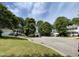 Neighborhood street view showcasing well-maintained homes, green trees, and landscaped front yards at 2208 Fieldmont Ct, Raleigh, NC 27614