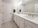 Bathroom features double sinks and a large mirror at 224 Midden Way, Holly Springs, NC 27540