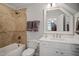 Bathroom features a tub and shower combo at 224 Midden Way, Holly Springs, NC 27540