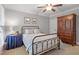Cozy bedroom with a comfortable bed, decorative furniture, and ample natural light at 224 Midden Way, Holly Springs, NC 27540