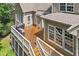 Spacious wooden deck with two barbecues, perfect for outdoor cooking and entertainment, accessible from the main house at 224 Midden Way, Holly Springs, NC 27540
