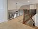 Hallway features carpet flooring, wood railing, and neutral color scheme at 224 Midden Way, Holly Springs, NC 27540
