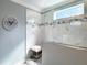 Luxurious shower space featuring designer tile, glass enclosure, and spa-like ambiance at 224 Midden Way, Holly Springs, NC 27540