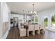 Bright, open dining area connecting to a modern kitchen with island at 226 Macon Lake Drive # 41, Apex, NC 27523