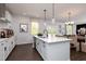 Bright kitchen with an island and modern finishes and fixtures at 226 Macon Lake Drive # 41, Apex, NC 27523