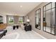 Bright and airy living room offering comfortable seating, contemporary accents, and scenic outdoor views at 226 Macon Lake Drive # 41, Apex, NC 27523