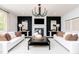 Elegantly decorated living room featuring a cozy fireplace and stylish furniture at 226 Macon Lake Drive # 41, Apex, NC 27523