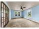 Bedroom featuring blue walls, carpet, and a ceiling fan at 2631 Harvard Ave, Durham, NC 27703