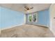 Bedroom featuring blue walls, carpet, and a window at 2631 Harvard Ave, Durham, NC 27703