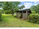 Outdoor gazebo with a lattice design, surrounded by lush greenery in the backyard at 2631 Harvard Ave, Durham, NC 27703
