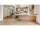 An open kitchen with breakfast bar, connected to the living spaces of the home at 2631 Harvard Ave, Durham, NC 27703