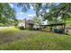 View of the side and rear of the home and parking area at 2631 Harvard Ave, Durham, NC 27703