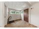 An empty room with a wooden floor with some windows at 2631 Harvard Ave, Durham, NC 27703