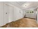 An empty room with a wooden floor with some windows and white walls at 2631 Harvard Ave, Durham, NC 27703