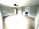 Spacious bedroom featuring light hardwood floors, ceiling fan, and gray walls at 2651 Bowden Dr, Creedmoor, NC 27522