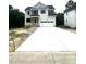 Two-story home features a wide driveway leading to an attached two-car garage at 2651 Bowden Dr, Creedmoor, NC 27522