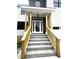 Inviting front porch with stone steps and wooden railing offers a welcoming entrance at 2651 Bowden Dr, Creedmoor, NC 27522