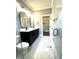 Stylish bathroom featuring double vanity, large tiled shower, and linen closet at 2661 Bowden Dr, Creedmoor, NC 27522