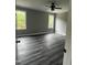 Cozy bedroom with neutral paint, two windows, and hardwood floors at 2661 Bowden Dr, Creedmoor, NC 27522