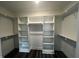 Walk-in closet offering ample storage and custom shelving at 2661 Bowden Dr, Creedmoor, NC 27522