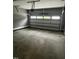 Clean and spacious two-car garage with concrete floor, and automatic door at 2661 Bowden Dr, Creedmoor, NC 27522
