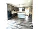 Modern kitchen featuring an island, stainless appliances, stylish cabinetry, and eat-in nook at 2661 Bowden Dr, Creedmoor, NC 27522