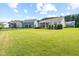 Expansive backyard with lush green grass and manicured landscaping, perfect for outdoor activities and relaxation at 3333 Jones Lake Rd, Fuquay Varina, NC 27526