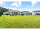 Spacious backyard featuring a well-maintained lawn, ideal for entertaining and enjoying outdoor living at 3333 Jones Lake Rd, Fuquay Varina, NC 27526