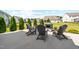 Spacious backyard with patio, modern seating, and lush green grass at 3333 Jones Lake Rd, Fuquay Varina, NC 27526