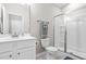 Bright bathroom with a glass shower door and vanity with light walls and fixtures at 3333 Jones Lake Rd, Fuquay Varina, NC 27526