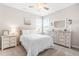 Bright bedroom with a large window, ceiling fan, and neutral color scheme, creating a relaxing retreat at 3333 Jones Lake Rd, Fuquay Varina, NC 27526